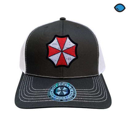 Gorra Resident Evil “Umbrella Logo” Negra-Blanca Premium Trucker