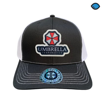 Gorra Resident Evil “Umbrella Corporation” Negra-Blanca Premium Trucker